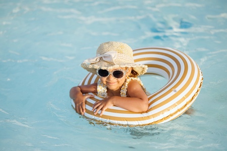 A little girl enjoys summer outdoor activities in Hua Hin