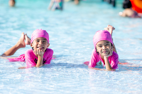Twins enjoying a safe shallow-water pool